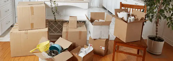 Packed moving boxes and household items in a kitchen before move-out or move-in cleaning, Nashville, TN.